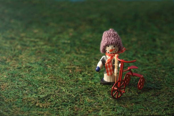 istock snowman with a bike 1131792888