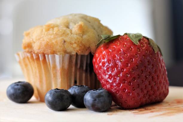 istock Breakfast Arrangement using a muffin, a strawberry, and four blueberries 1131794735