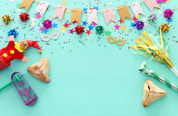 istock Purim celebration concept (jewish carnival holiday) over wooden blue background 1131794755