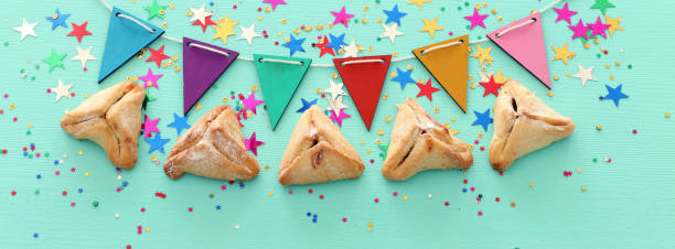 istock Purim celebration concept (jewish carnival holiday) over wooden mint background 1131794758