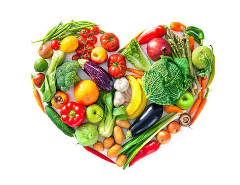 Heart shape by various vegetables and fruits. Healthy food concept. Isolated on white background