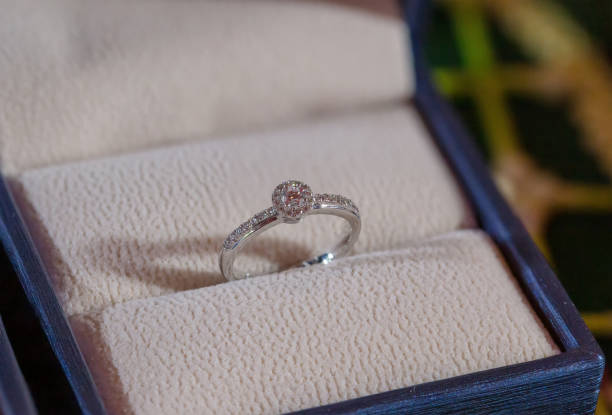 istock Diamond ring, wedding ring, Wedding Ring bride price. Wedding symbols. Wedding ceremony. image for objects and article.rings on wooden surface, symbol of couple 1131796024