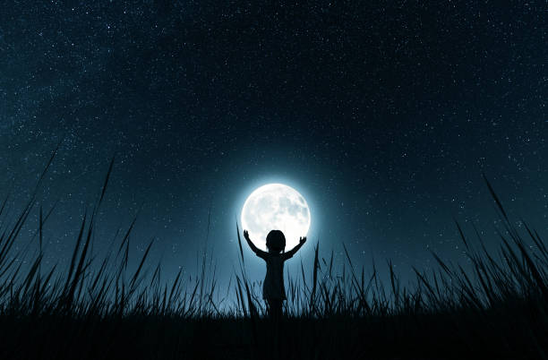 istock Girl holding the moon 1131796255