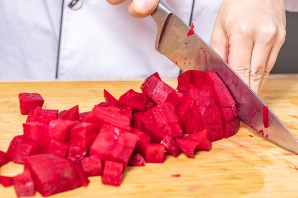 Cropped shot of a woman preparing a healthy meal at home