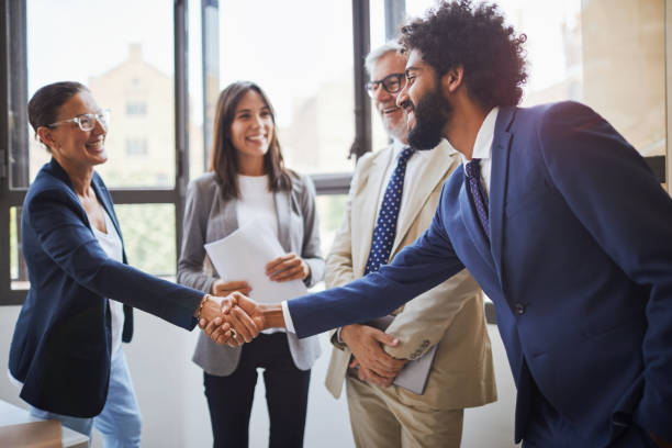 istock Standing business meeting. 1131797650