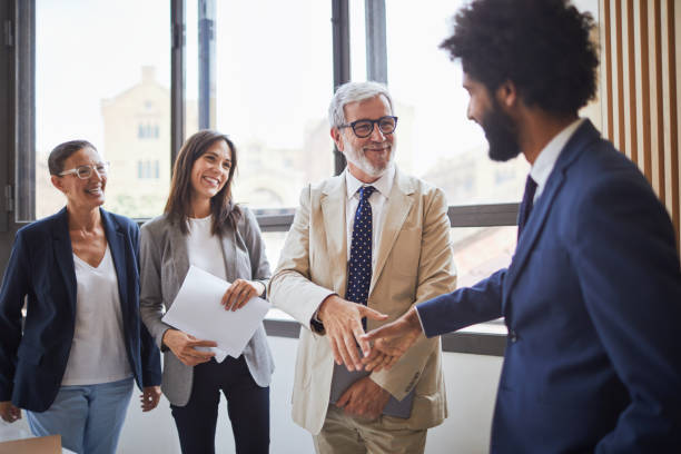 istock Standing business meeting. 1131797651