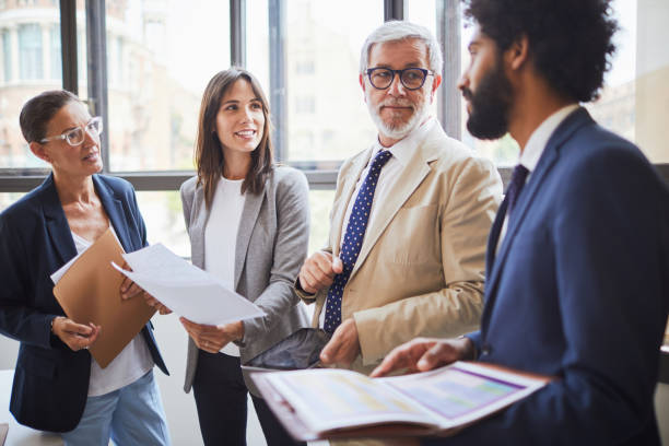 istock Standing business meeting. 1131797654