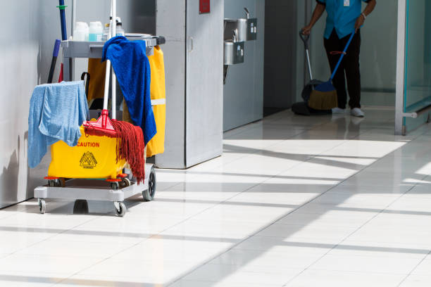 istock Mop bucket on cleaning in process and worker background 1131804371