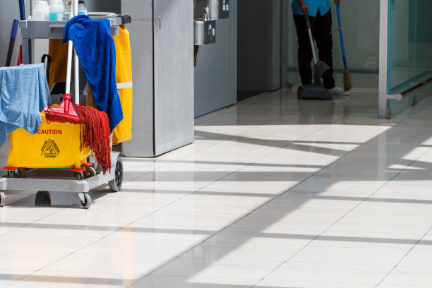 istock Mop bucket on cleaning in process and worker background 1131804406