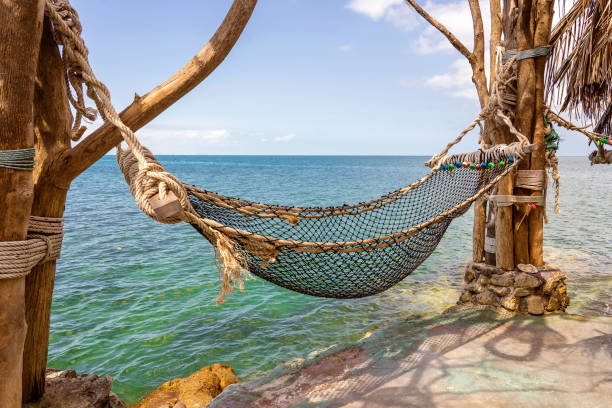 istock Empty hammock on beautiful tropical beach near sea water Thailand 1131804613