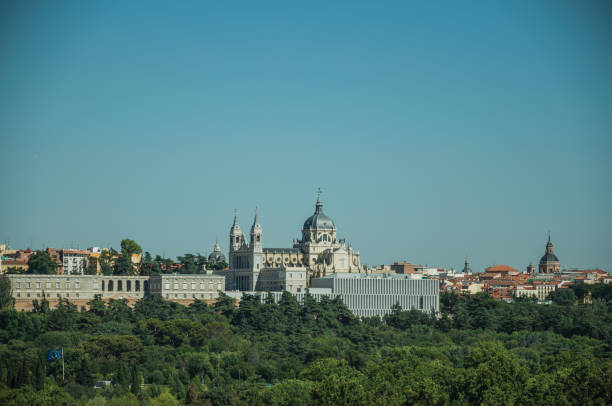 istock Royal Palace and Almudena Cathedral with trees in Madrid 1131805395