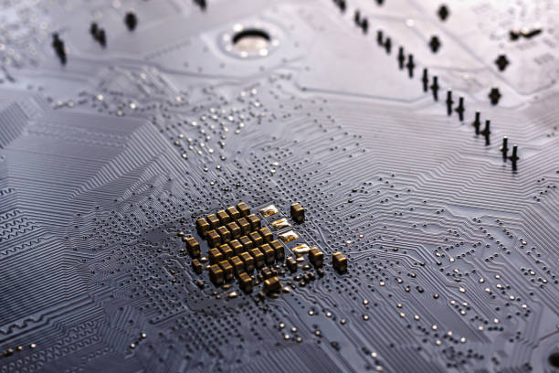 Close up of a backlit computer motherboard. Symmetrical composite.
