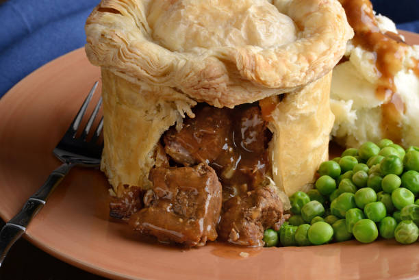 istock closeup steak pub pie with gravy and fork 1131810677