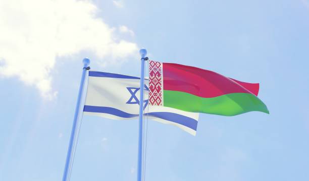 istock Israel and Belarus, two flags waving against blue sky 1131811860