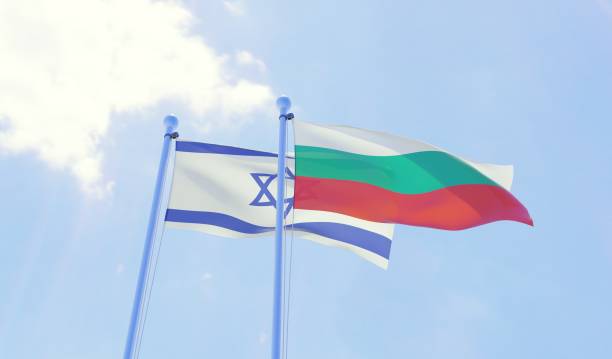 istock Israel and Bulgaria, two flags waving against blue sky 1131811862