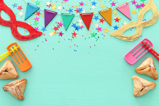 istock Purim celebration concept (jewish carnival holiday) over wooden blue background 1131812018