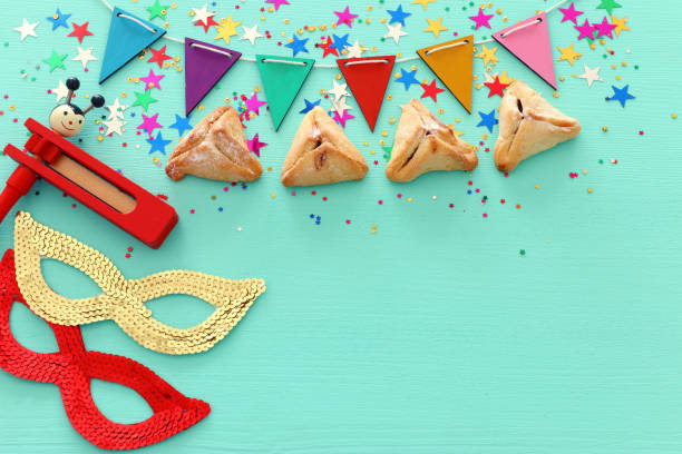 istock Purim celebration concept (jewish carnival holiday) over wooden blue background 1131812020