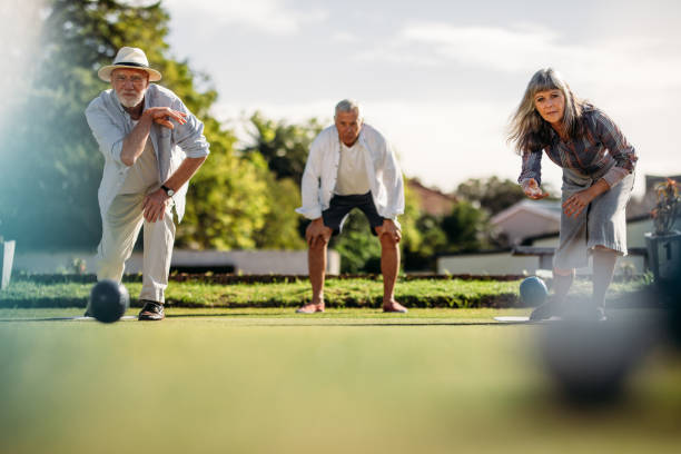istock Elderly couple playing boules in a park 1131812426