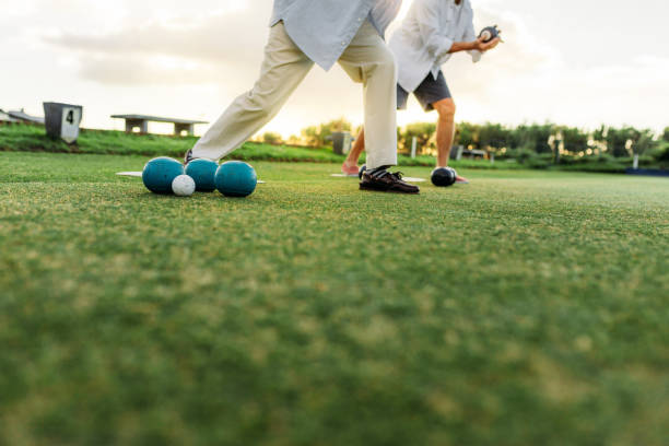 istock People playing boules in a park 1131812533
