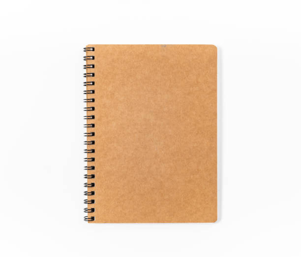 istock Brown spiral notebook isolated on white background.top view 1131812606