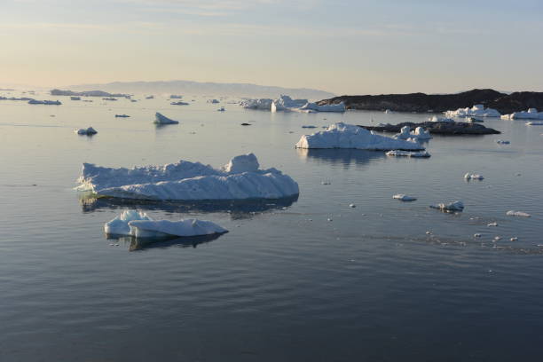 istock Icebergs are melting on arctic ocean in Greenland 1131813705