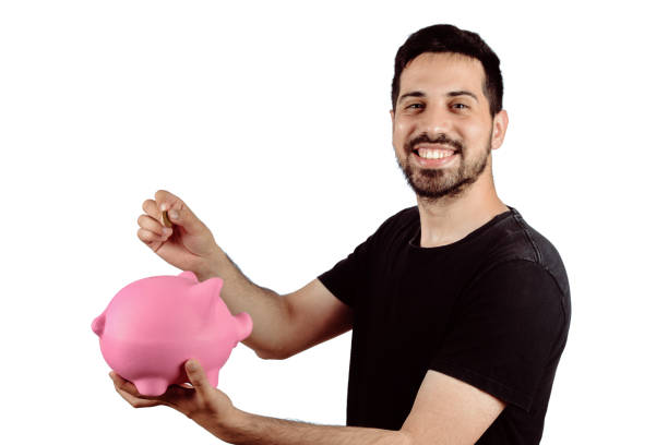 istock Young man with piggy bank 1131814961