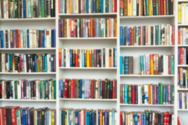 istock Blurred image of colorful bookshelf In secondhand shop. 1131815226