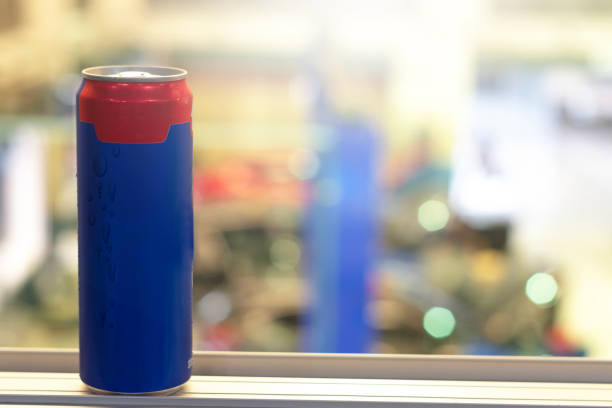 Blue can Coca Cola for drinks to refresh on blurred background For advertising of drinks image