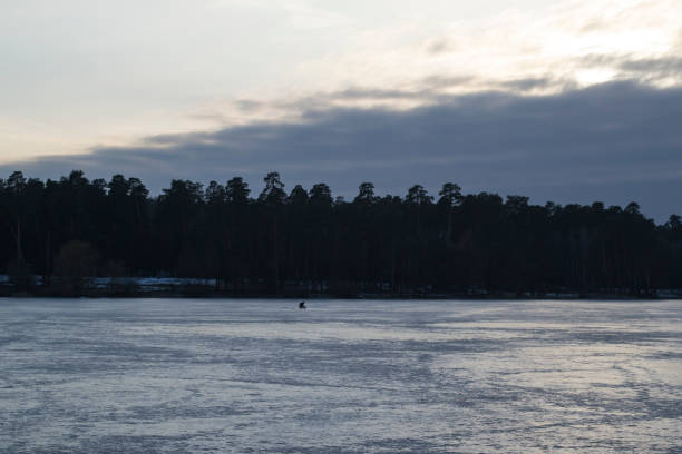 istock Frozen lake in fog. 1131817864