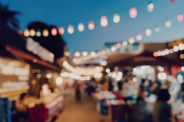 blurred background at night market festival people walking on road. blurred background at night market festival people walking on road. bar exterior stock pictures, royalty-free photos & images