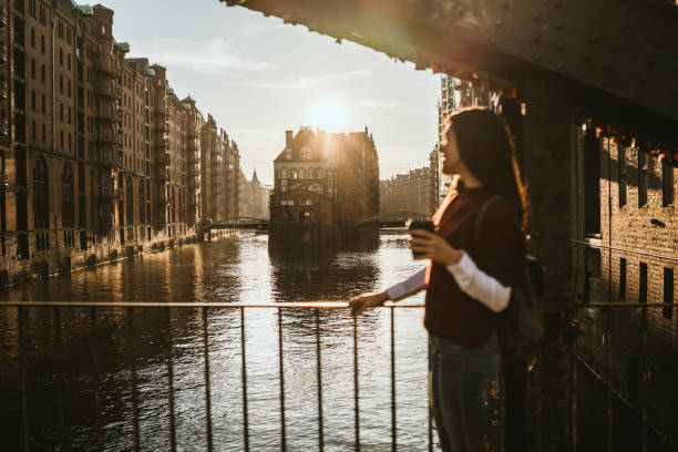istock Woman exploring Hamburg old town 1131818456