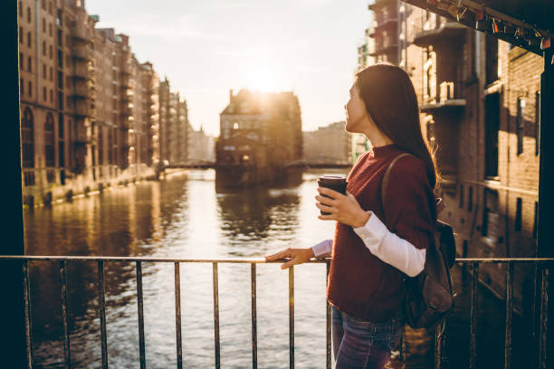 istock Woman exploring Hamburg old town 1131818620