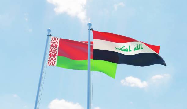 istock Iraq and Belarus, two flags waving against blue sky 1131819942