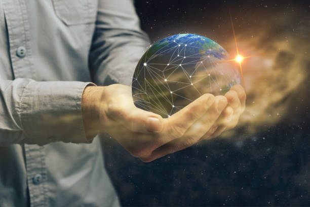 istock Protect our world in human hands and nebula dust. Mixed media. 1131821946
