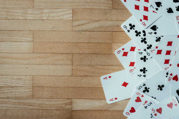 istock Cards lying on rustic wood table, playing cards. Copy space. 1131822772