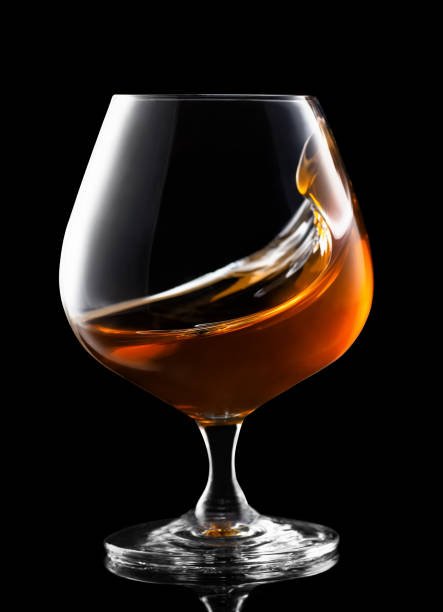 istock splash of cognac in snifter glass 1131822773
