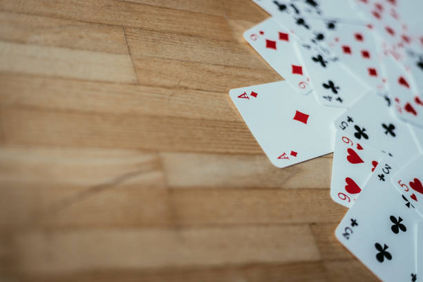 istock Cards lying on rustic wood table, playing cards. Copy space. 1131822879