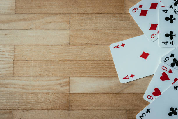 istock Cards lying on rustic wood table, playing cards. Copy space. 1131822901