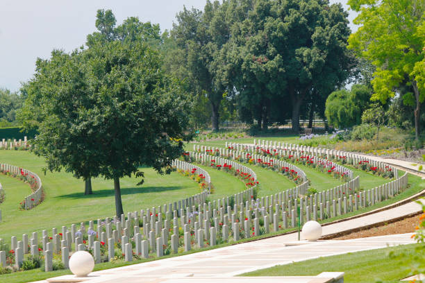 istock Rows of headstones placed in semicircle in the Sangro River War Cemetery 1131823047