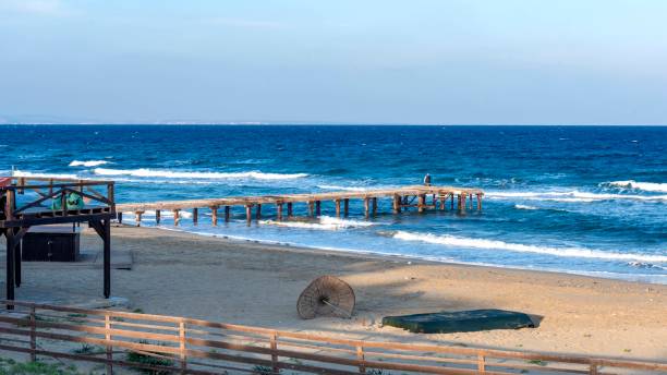 The beach near Salamis, Cyprus, depicted at sunset at the end of the summer season