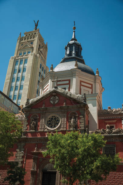 istock Skyscraper and church facade with dome in Madrid 1131824118