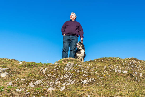 istock Senior Caucasian man with dog 1131824515