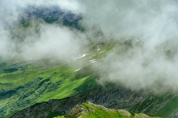 istock Berghang mit Schneefeldern. Mountain side with snowfields. 1131827603