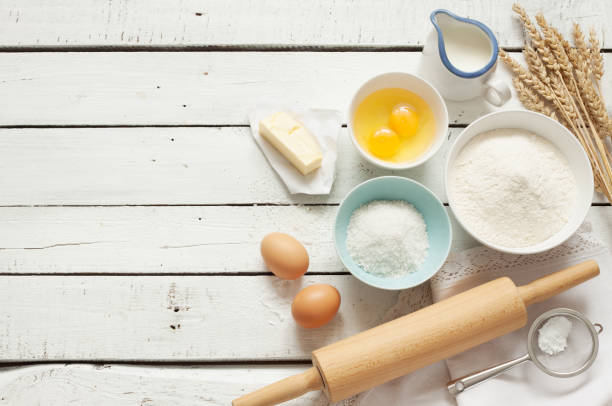istock Rustic kitchen - dough recipe ingredients on white wood 1131829181