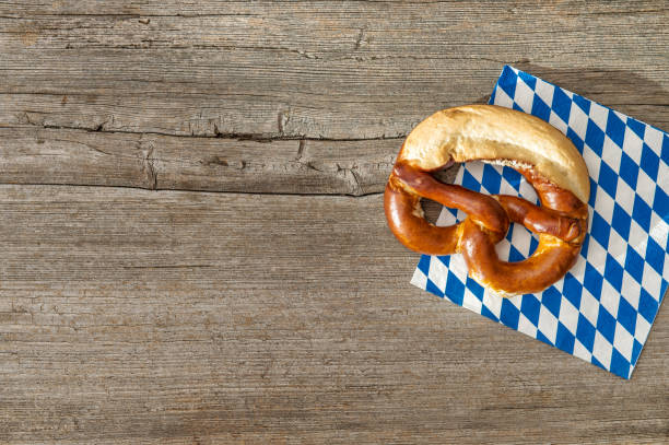istock Bavarian bread pretzel vintage wooden board background 1131831254