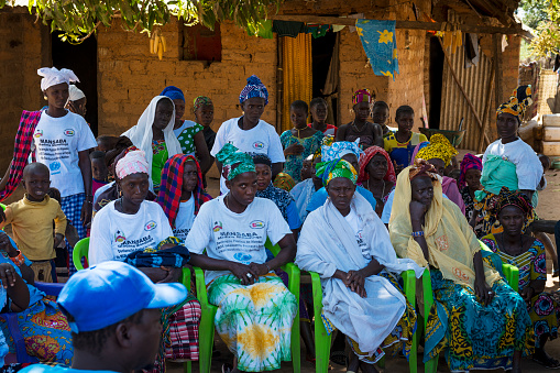 Gabu Region, Republic of Guinea-Bissau - February 7, 2018: Group of women and children at a community meeting in the village of Mandina Mandinga in the Gabu Region, Guinea Bissau