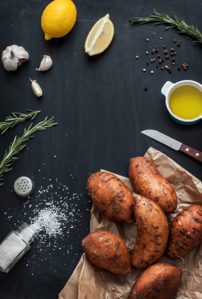 istock Preparing rosemary roasted sweet potatoes - kitchen scenery from above 1131831873