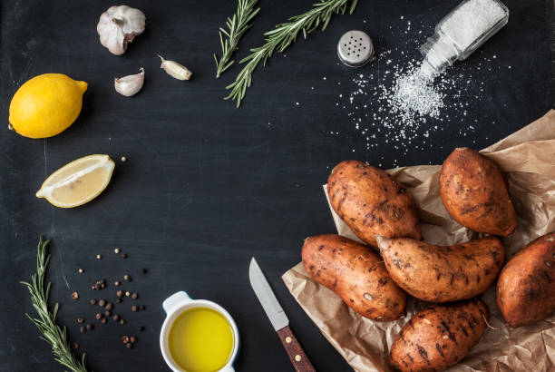 Preparing rosemary roasted sweet potatoes - kitchen scenery from above