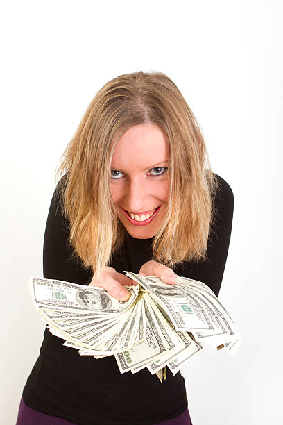 istock Young woman with us dollars and greedy smile 113183418