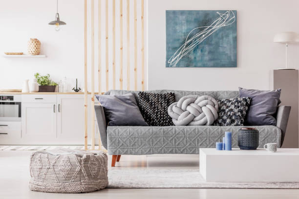 istock Wooden mullins wall in bright open plan studio apartment with kitchen and living room 1131834667